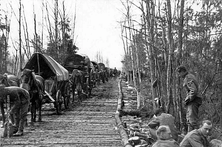 An endless column of horse-drawn wagons on a so-called corduroy road in April 1942, en route to the Volkhov.