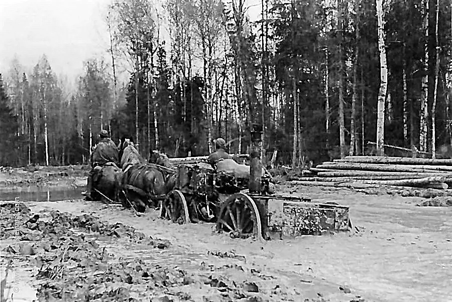 In April 1942, a field kitchen makes its way through the mud of the road to the Volkhov, sunk up to its axles.