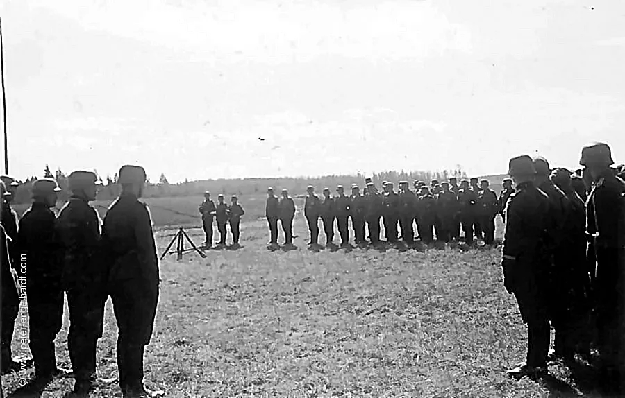 April 20, 1943. Soldiers line up in a meadow.